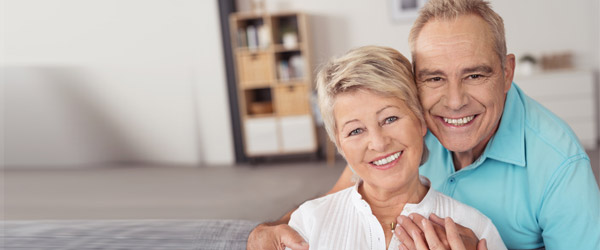 smiling-senior-couple-secure-in-their-home